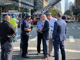 Authorities and egineers will remain in the site planning the safety removal of crane collapsed in NYC [Photo: KWWL]