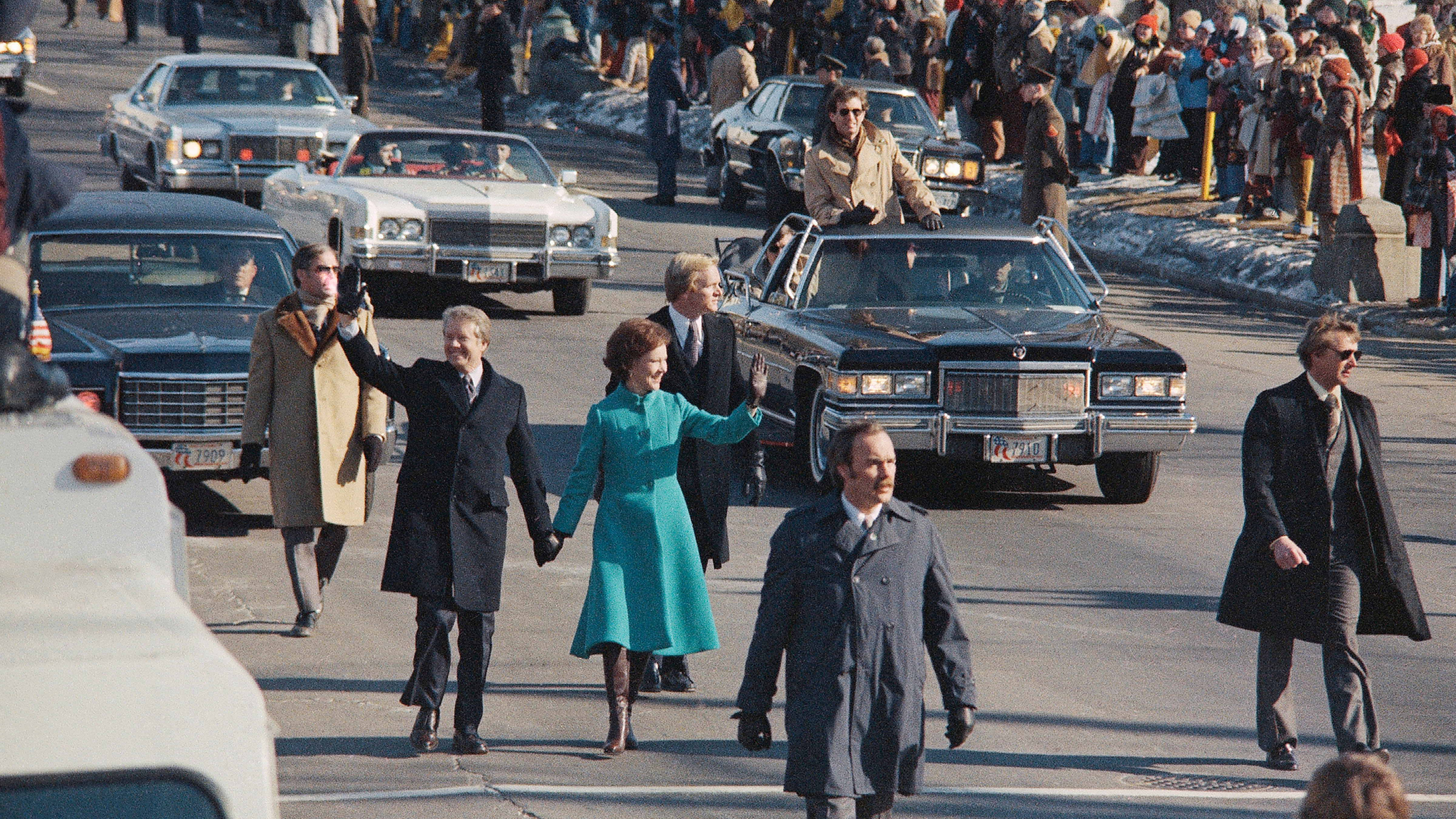 President Jimmy Carter and first lady Rosalynn Carter walk down Pennsylvania Avenue after Carter was sworn in as the nation's 39th president, Jan. 20, 1977, in Washington.